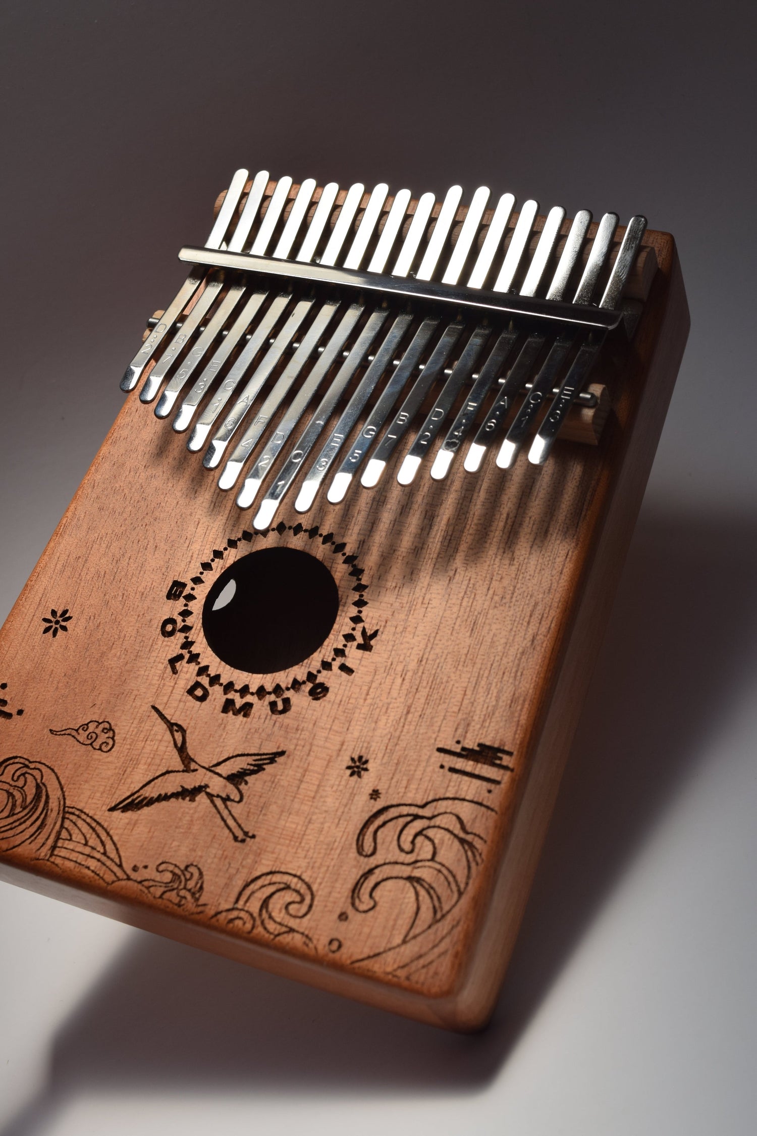 Image of a kalimba with a white background in nice lighting.
